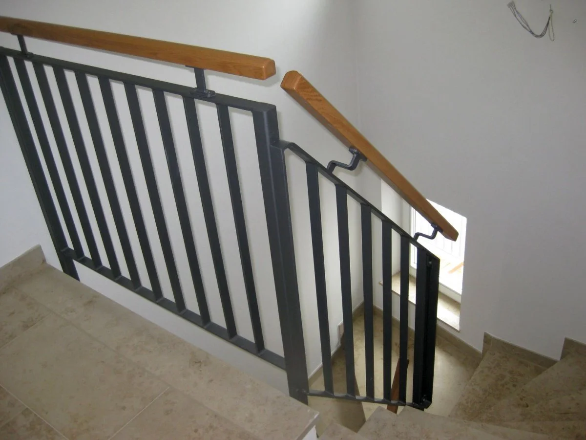 Interior railing with wood handrail