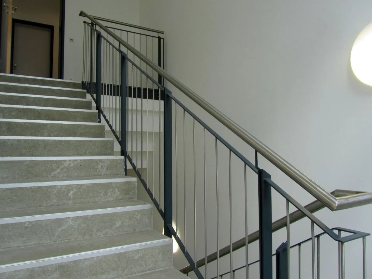 Interior railing with stainless steel handrail